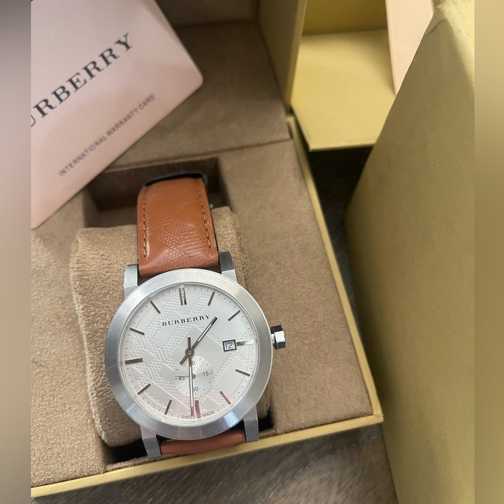 Burberry men’s watch. Original and all packaging included. Used few times only.